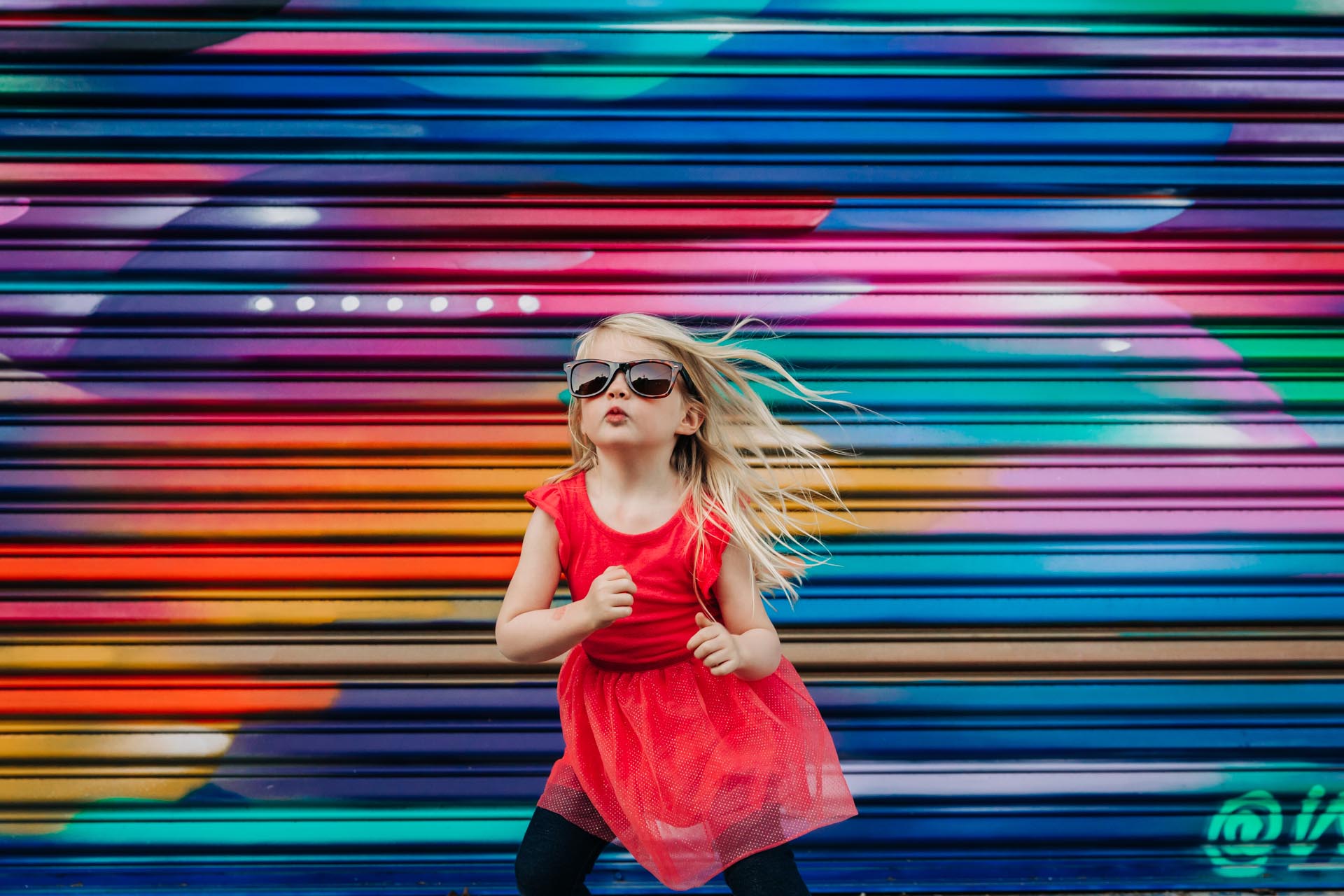 Best photographer award winner photo of girl in red dress and sunglasses