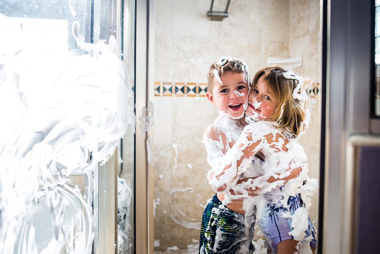 Children playing in shaving cream on Adobe Stock Images