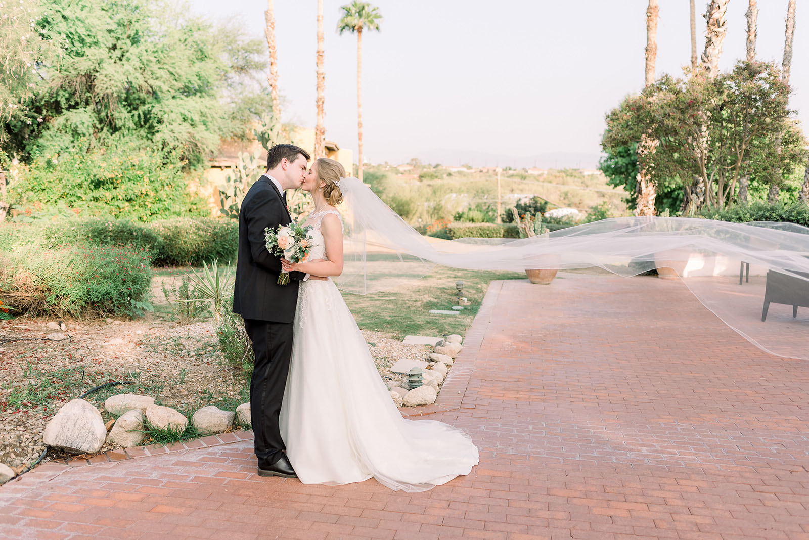 Anh Maness @westendphotography love in the time of covid Bride and groom kiss during Covid wedding photos