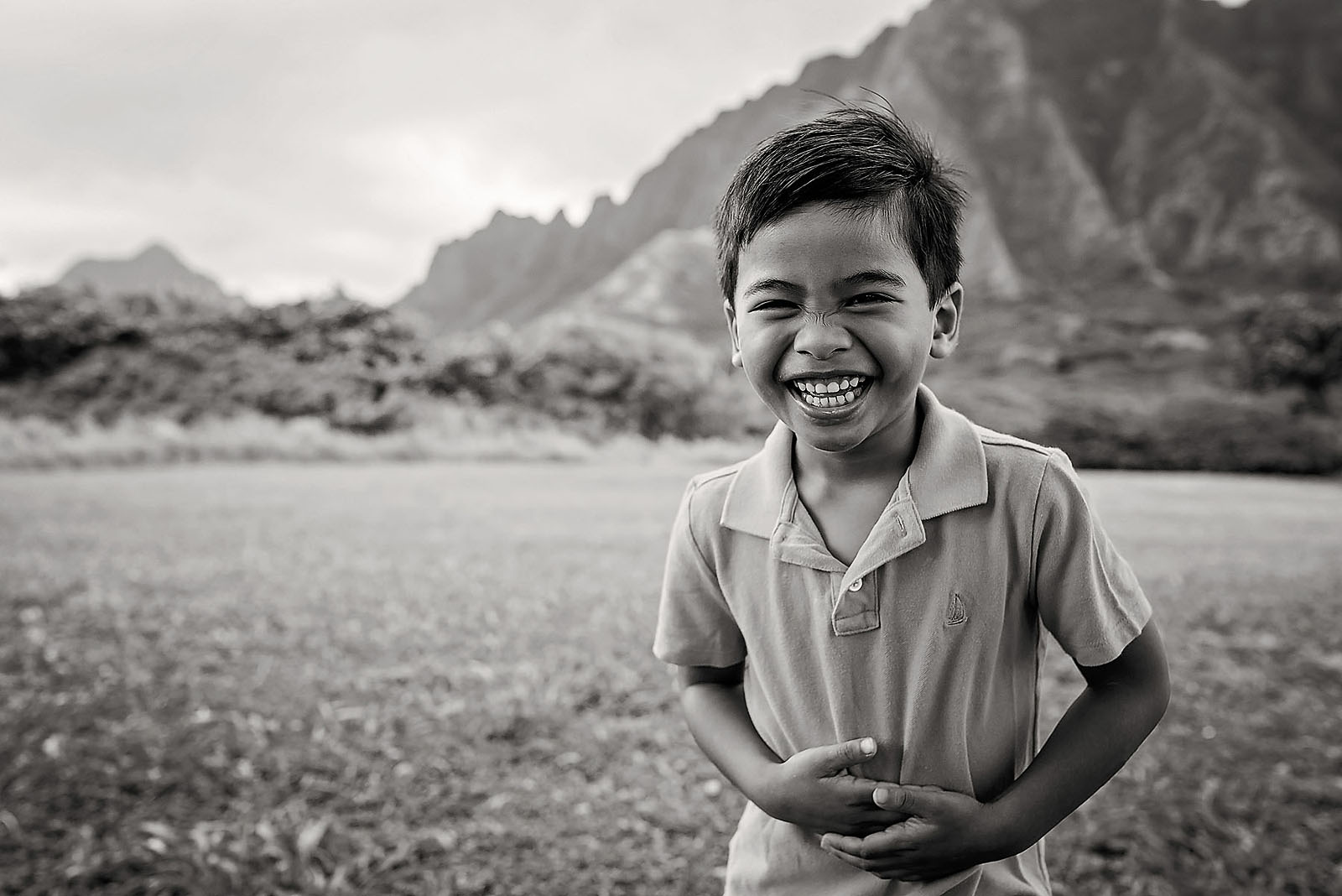 black and white photo of boy laughing by Allison Gipson