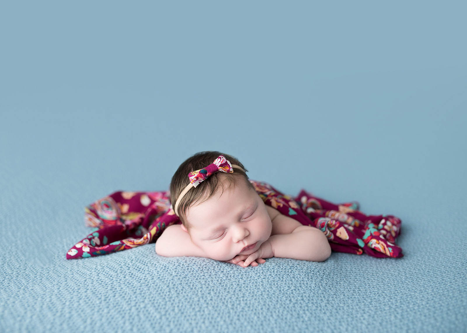 exceptional-client-experience-photography-11 Newborn baby on blue blanket