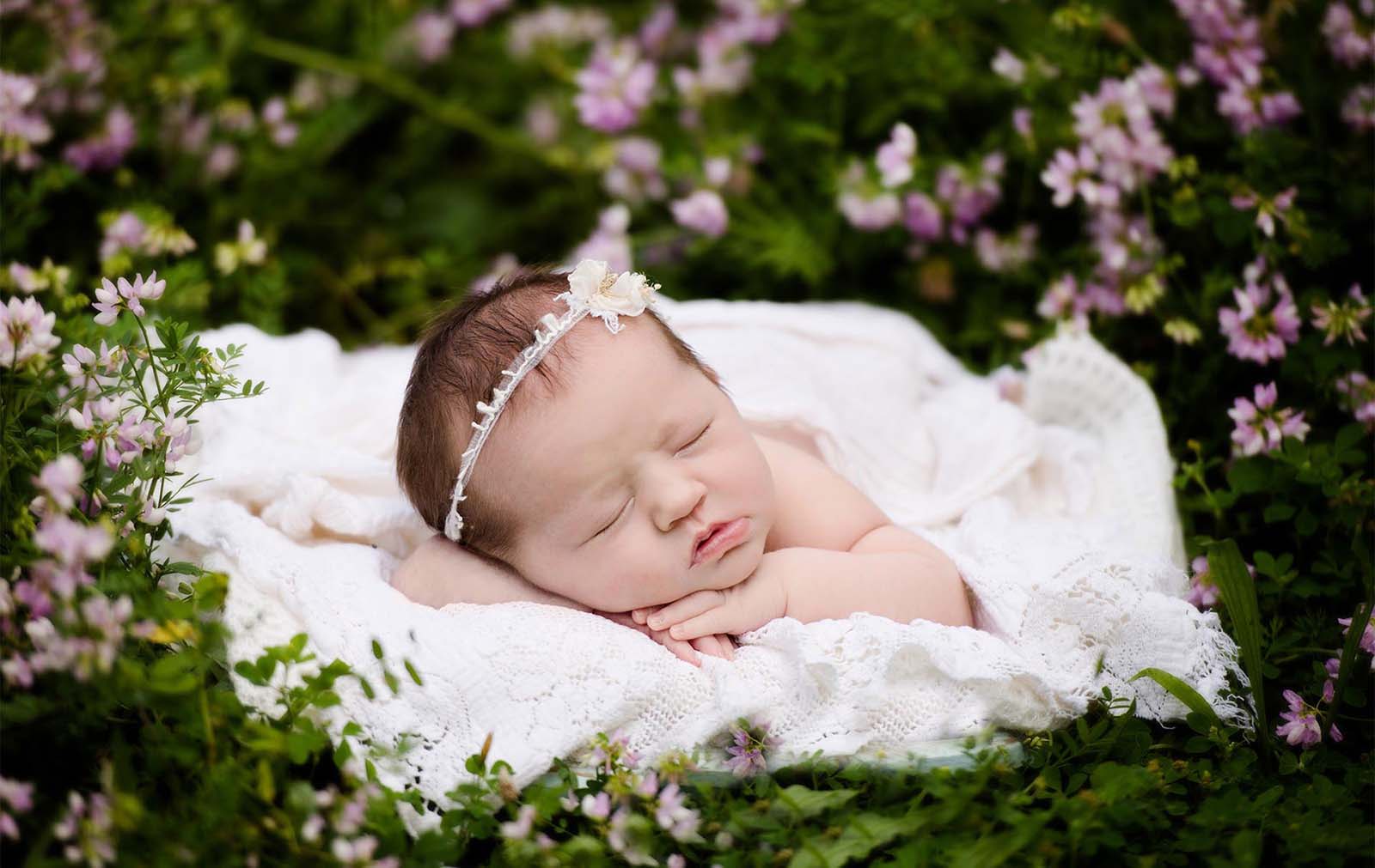 exceptional-client-experience-photography-19 Adorable newborn baby girl surrounded by flowers