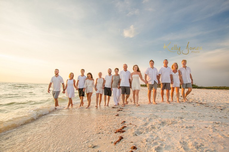 extended family group portrait on the beach by Kelly Jones