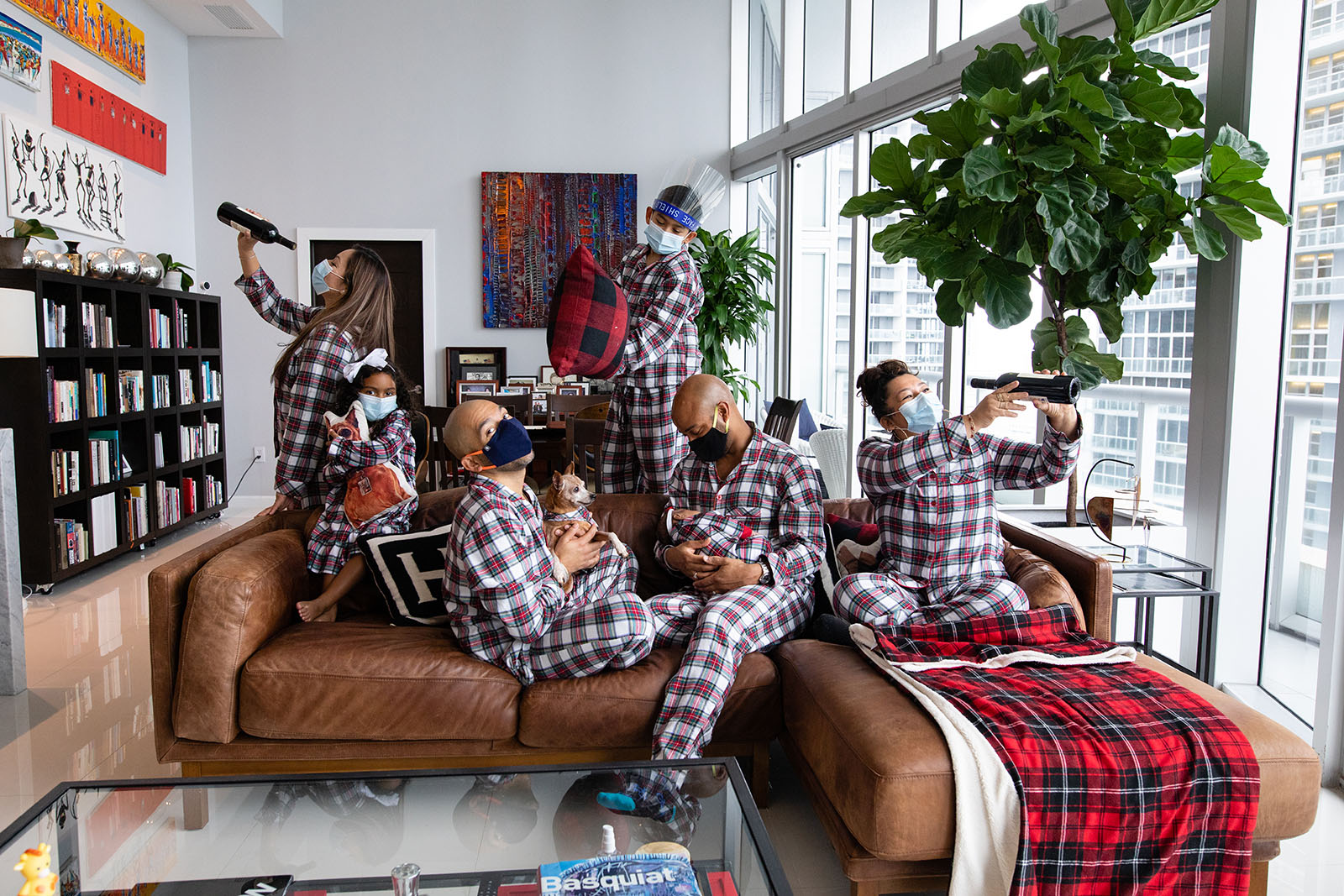 Large family in matching Christmas pajamas during COVID photo session