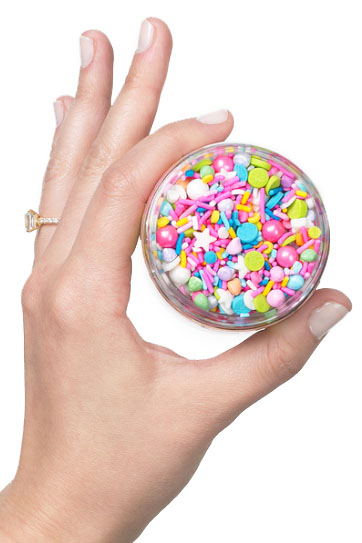Hand holding sprinkles, client gifts