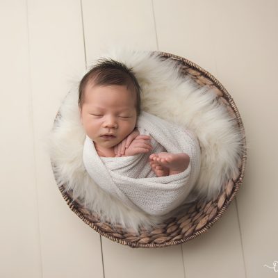 Learn how newborn photographer Ashley Fitzgerald converted her garage into a photo studio!