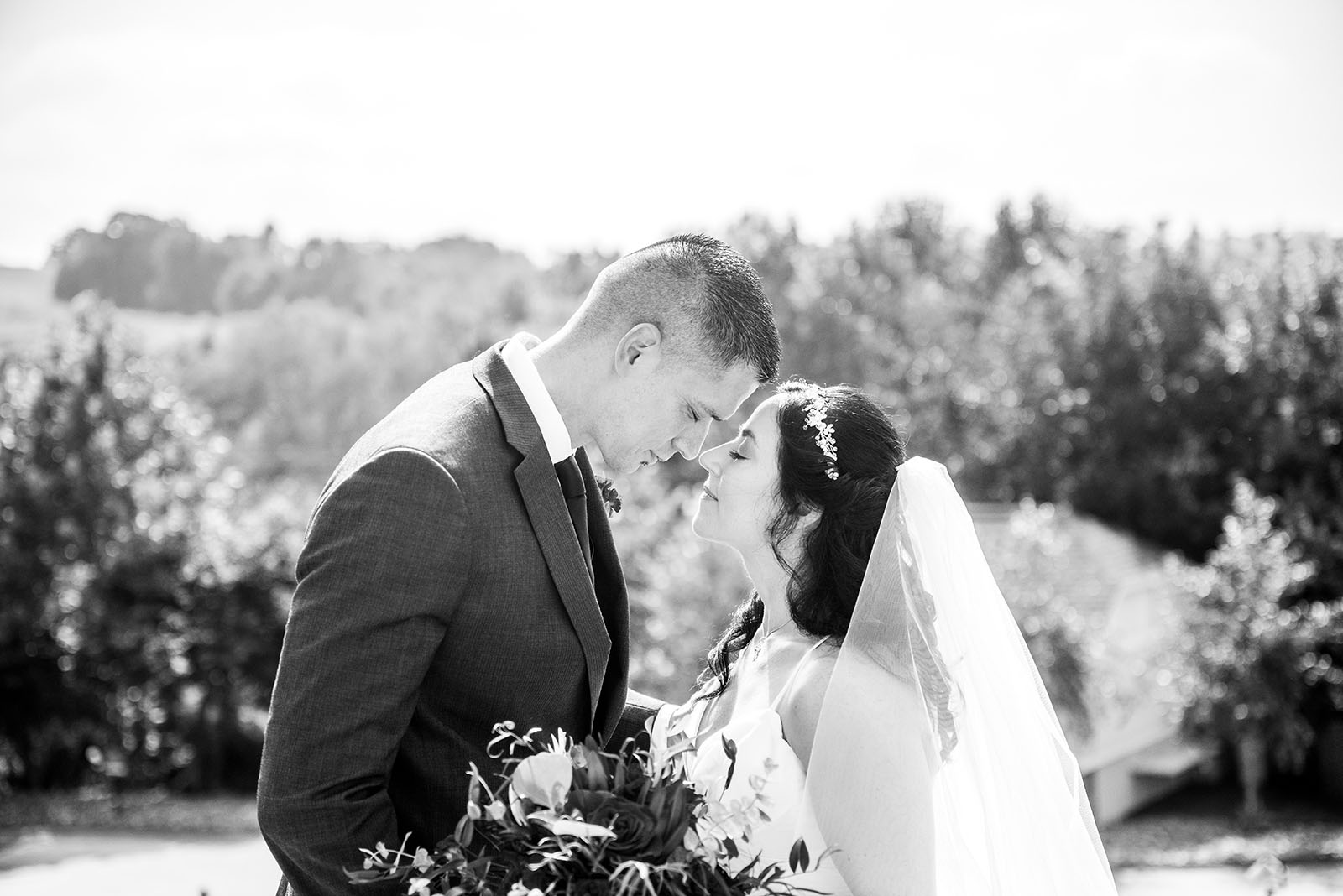 jacquelynn buck @photographybyjacquelynn @forever_afters love in the time of covid 1 A couple kisses during Covid wedding photos