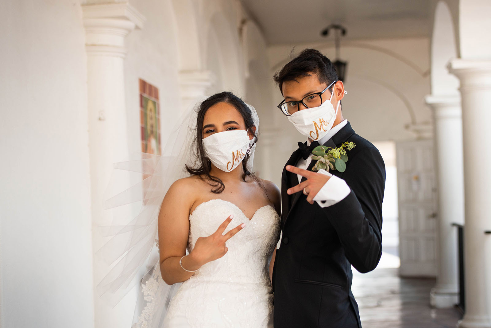 Jen Schrantz @jenbeephotography 2 love in the time of covid Bride and groom in masks during Covid wedding pictures