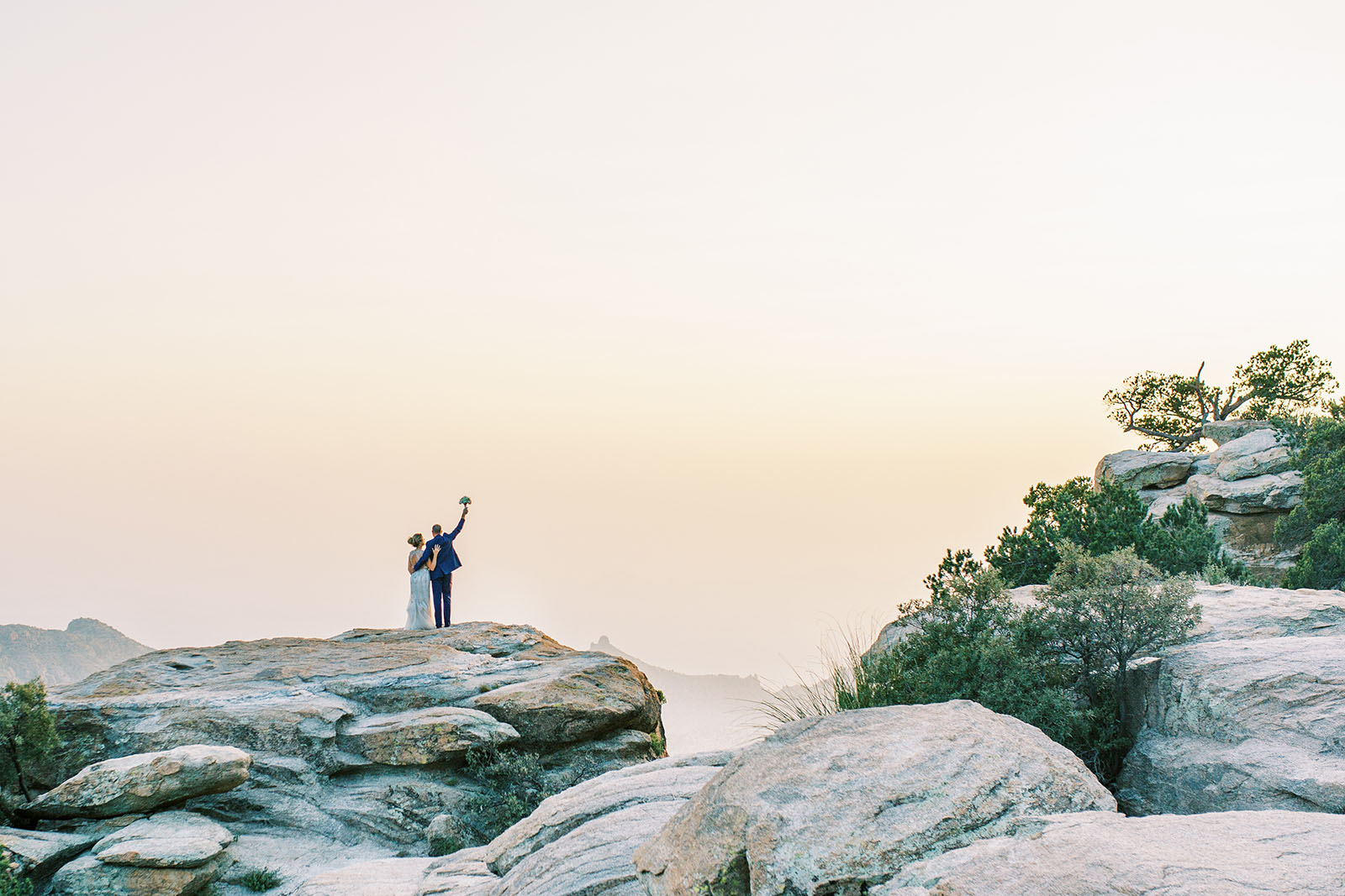 KileyHarmonPhotography @kileyharmonphoto 1 love in the time of covid Bride and Groom on a cliff during Covid wedding photos