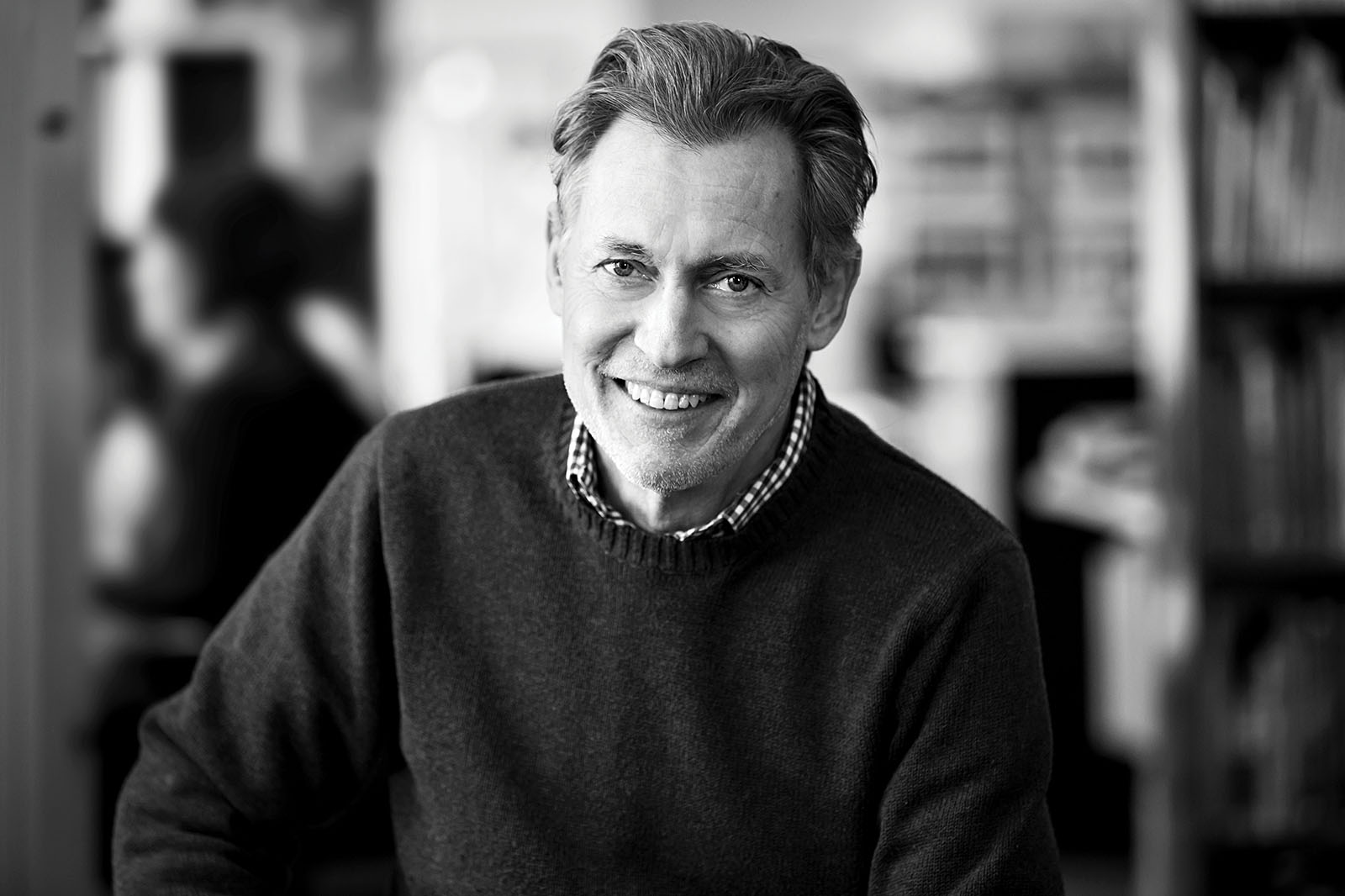 Headshot of a man leaning in to the camera