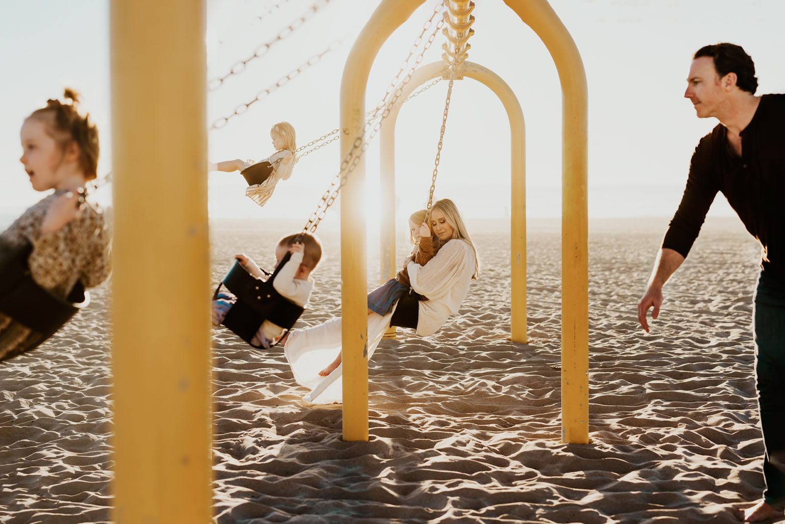 LIFESTYLE_ALFERENKO_O_51 family photo on swings