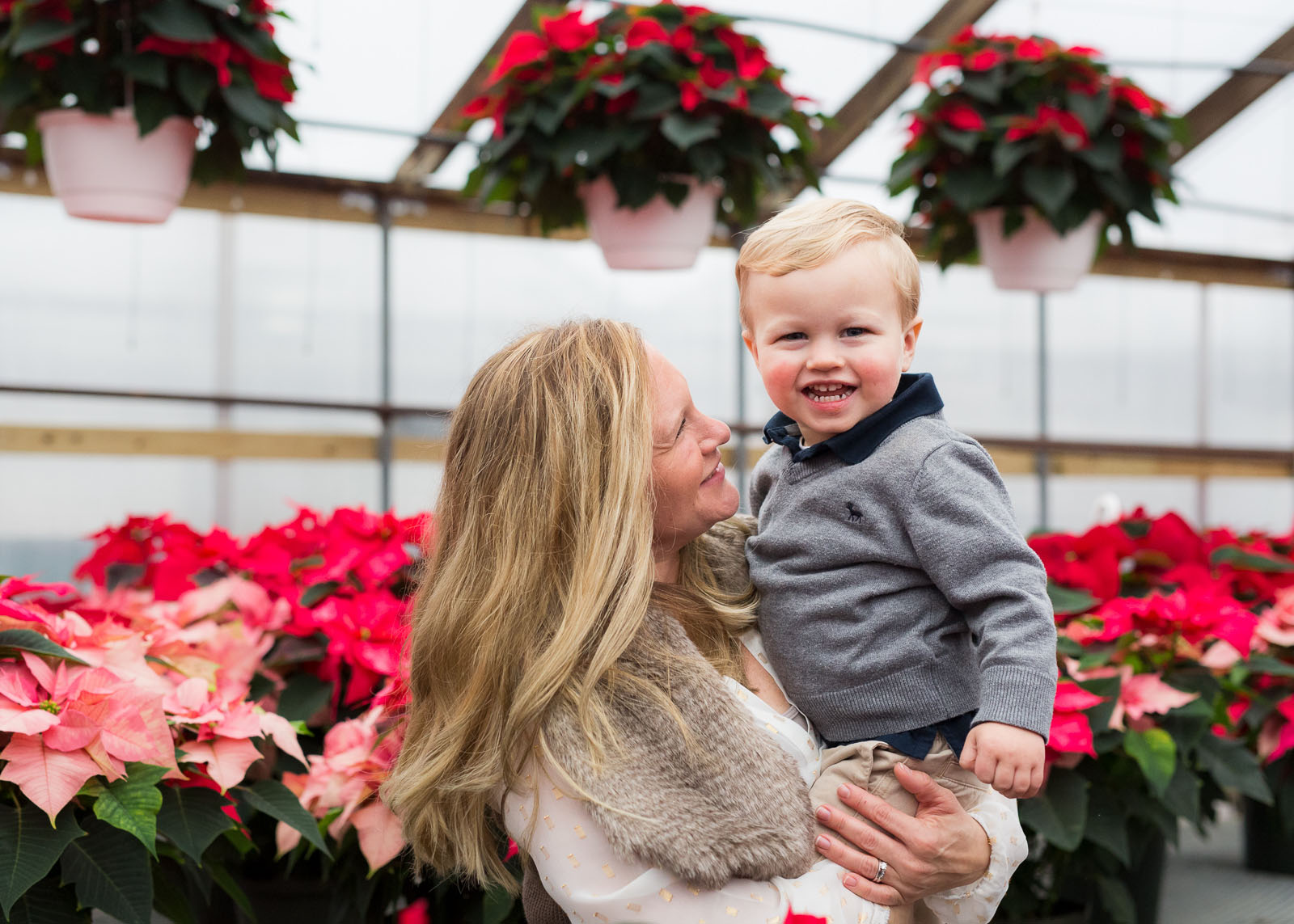 photo of mom and son in a greenhouse by Kristy Dooley