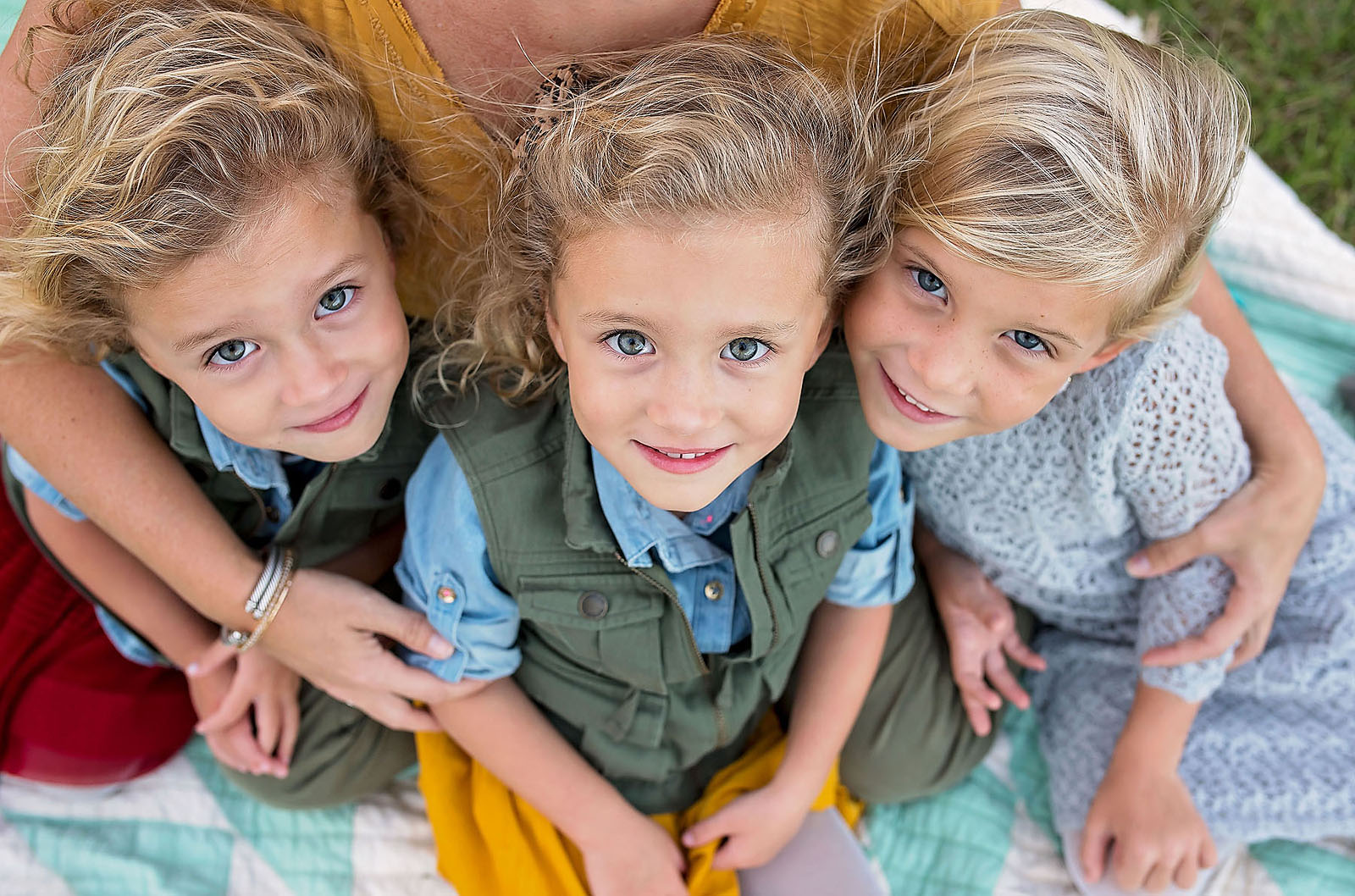 picture of 3 little girls looking up and smiling by Allison Gipson