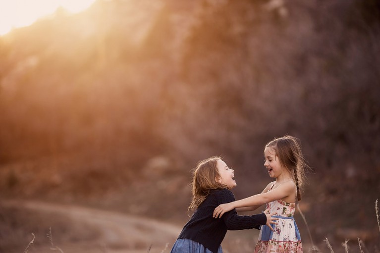 photo of two girls laughing together by Sally Molhoek