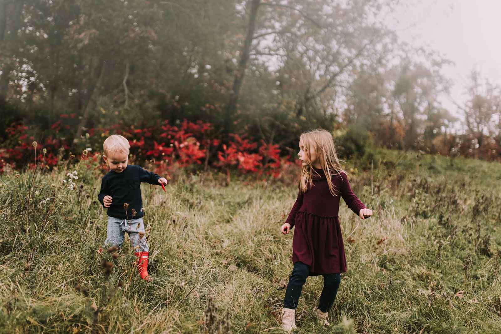 A girl and a boy play. Finding balance with photography and motherhood