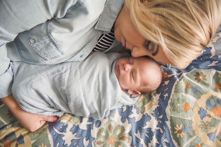 picture of mom snuggling newborn by Erin Schmidt