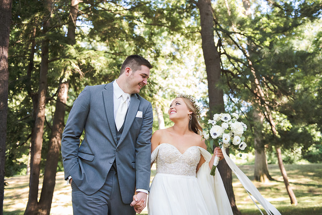 portrait of bride and groom looking at each other by Erin Schmidt