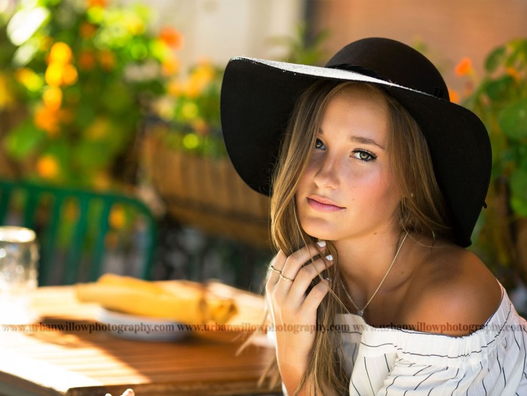 senior photography of girl with a hat on by Lori Vieth